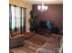 A cozy living room with wood-look floors, comfortable furnishings, and natural light at 464 Laurel Fork Dr, Fort Mill, SC 29715