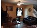 Cozy living room boasts hardwood floors and comfortable seating arrangement at 464 Laurel Fork Dr, Fort Mill, SC 29715