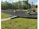 Well-maintained playground with swings, slides and other play structures for the community's enjoyment at 464 Laurel Fork Dr, Fort Mill, SC 29715