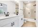 Bright bathroom features a double vanity with granite countertop, framed mirror, and a glass-enclosed tiled shower at 540 Church St, Locust, NC 28097