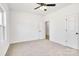This bedroom has carpeted floors, a ceiling fan, and a door leading to a closet at 540 Church St, Locust, NC 28097