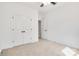Empty carpeted bedroom with ceiling fan, and ample closet space at 540 Church St, Locust, NC 28097