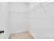Walk-in closet features carpeted flooring and ample storage space with wire shelving at 540 Church St, Locust, NC 28097