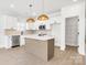 Beautiful kitchen with stainless steel appliances, kitchen island, and ample storage space at 540 Church St, Locust, NC 28097