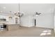 View of open-concept living space, featuring hard wood flooring, modern fixtures, and ample natural light at 540 Church St, Locust, NC 28097