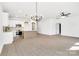 View of an open-concept living space with bright, natural light, modern fixtures, and hard wood flooring at 540 Church St, Locust, NC 28097