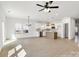 Open-concept living space with bright, natural light, modern fixtures, and hard wood flooring at 540 Church St, Locust, NC 28097