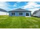 Inviting backyard with a well-maintained lawn, perfect for outdoor activities and relaxation at 544 Church St, Locust, NC 28097