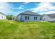Lush backyard with freshly cut green grass, offering ample space for recreation and entertainment at 544 Church St, Locust, NC 28097
