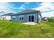 Spacious backyard with a sliding glass door, ideal for enjoying the outdoors and easy indoor-outdoor flow at 544 Church St, Locust, NC 28097