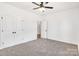 Spacious bedroom with double door closet and entry, soft carpet flooring and neutral paint at 544 Church St, Locust, NC 28097