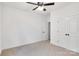 Clean bedroom featuring plush carpet, ceiling fan, and a spacious closet at 544 Church St, Locust, NC 28097
