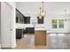 Stylish kitchen featuring a center island, stainless steel appliances, and ample counter space at 544 Church St, Locust, NC 28097