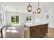 Open living space featuring a kitchen with modern appliances and access to a large yard at 544 Church St, Locust, NC 28097