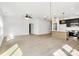 Bright, open-concept living area with contemporary lighting fixtures at 544 Church St, Locust, NC 28097