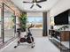 Bright exercise room featuring exposed brick wall, large mirror, and exercise bike at 5516 Swaling St, Charlotte, NC 28217