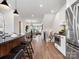Spacious open concept kitchen featuring stainless appliances and breakfast bar seating at 5516 Swaling St, Charlotte, NC 28217