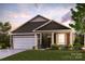 Charming single-Gathering home with a two-car garage, brick accents, and a well-manicured lawn at 562 Mountain View Dr, Monroe, NC 28110
