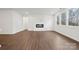 Spacious living room featuring a modern fireplace, hardwood floors, and lots of natural light at 562 Mountain View Dr, Monroe, NC 28110