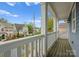 Charming balcony with a view of the neighborhood and surrounding greenery at 612 Baldwin Ave, Charlotte, NC 28204