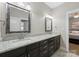 Stylish bathroom with a granite countertop, double sinks, and modern fixtures at 612 Baldwin Ave, Charlotte, NC 28204