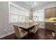 Inviting dining room featuring hardwood floors, large windows, and modern decor at 612 Baldwin Ave, Charlotte, NC 28204