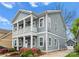 Side view of a two-story home featuring a small balcony, driveway, and detached garage at 612 Baldwin Ave, Charlotte, NC 28204