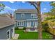 Two-story home featuring a well-manicured lawn, a fire pit, and an outdoor patio with grill at 612 Baldwin Ave, Charlotte, NC 28204