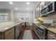 Spacious kitchen featuring stainless steel appliances, granite countertops, and an eat-in dining area at 612 Baldwin Ave, Charlotte, NC 28204