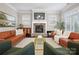 Inviting living area featuring a stone fireplace, modern furnishings, and natural light at 612 Baldwin Ave, Charlotte, NC 28204