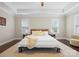 Main bedroom with tray ceilings, hardwood floors, and ample natural light at 612 Baldwin Ave, Charlotte, NC 28204