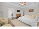 Spacious main bedroom with hardwood floors, ceiling fan, and ensuite bathroom at 612 Baldwin Ave, Charlotte, NC 28204