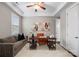 Comfortable home office with a sofa, desk, and ample natural light at 612 Baldwin Ave, Charlotte, NC 28204