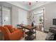 Well-lit office featuring a stylish desk, comfortable seating, and access to a bathroom at 612 Baldwin Ave, Charlotte, NC 28204