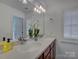 Bathroom featuring a double vanity, a large mirror, and stylish decor at 668 Sixth Baxter Xing, Fort Mill, SC 29708