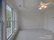 Bright bedroom with neutral carpet, white walls and ceilings and a ceiling fan with lights at 668 Sixth Baxter Xing, Fort Mill, SC 29708