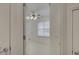 Bright bedroom featuring an open doorway with neutral carpet, and a ceiling fan with lights at 668 Sixth Baxter Xing, Fort Mill, SC 29708