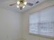 Bright bedroom featuring one window with white blinds and a ceiling fan with lights at 668 Sixth Baxter Xing, Fort Mill, SC 29708
