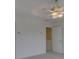 Bright bedroom featuring a ceiling fan with lights and an open door leading into another room at 668 Sixth Baxter Xing, Fort Mill, SC 29708