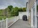 Enjoy outdoor living on this deck with white railings, privacy fence, and space for a grill at 668 Sixth Baxter Xing, Fort Mill, SC 29708