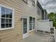 Exterior view of the house showing windows, a back door and partial view of the deck at 668 Sixth Baxter Xing, Fort Mill, SC 29708