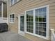 Exterior view of the house showing large windows and a back door at 668 Sixth Baxter Xing, Fort Mill, SC 29708