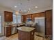 Kitchen featuring stainless steel appliances, granite countertops, and a kitchen island at 668 Sixth Baxter Xing, Fort Mill, SC 29708