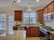 Kitchen area with stainless steel appliances and granite countertops near a glass paneled door at 668 Sixth Baxter Xing, Fort Mill, SC 29708