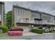 Townhome featuring a private balcony and rear entry garage, and tidy landscaping at 668 Sixth Baxter Xing, Fort Mill, SC 29708