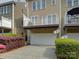 Townhome featuring a private balcony and rear entry garage, and tidy landscaping at 668 Sixth Baxter Xing, Fort Mill, SC 29708