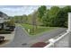 View of the street showing a landscaped median with trees at 668 Sixth Baxter Xing, Fort Mill, SC 29708