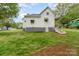 Side and rear of home with a side door, open yard, and steps to the main entrance at 745 6Th Sw Ave, Hickory, NC 28602