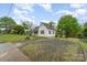 Well-maintained exterior with a gravel driveway and a quaint, fenced yard at 745 6Th Sw Ave, Hickory, NC 28602