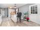 Kitchen with hardwood floors, white cabinetry, an island, and updated fixtures at 745 6Th Sw Ave, Hickory, NC 28602